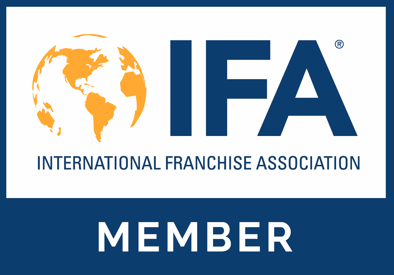 Logo with an orange globe and bold navy blue letters 'IFA' above the text 'International Franchise Association' and the word 'Member' below on a navy blue background.