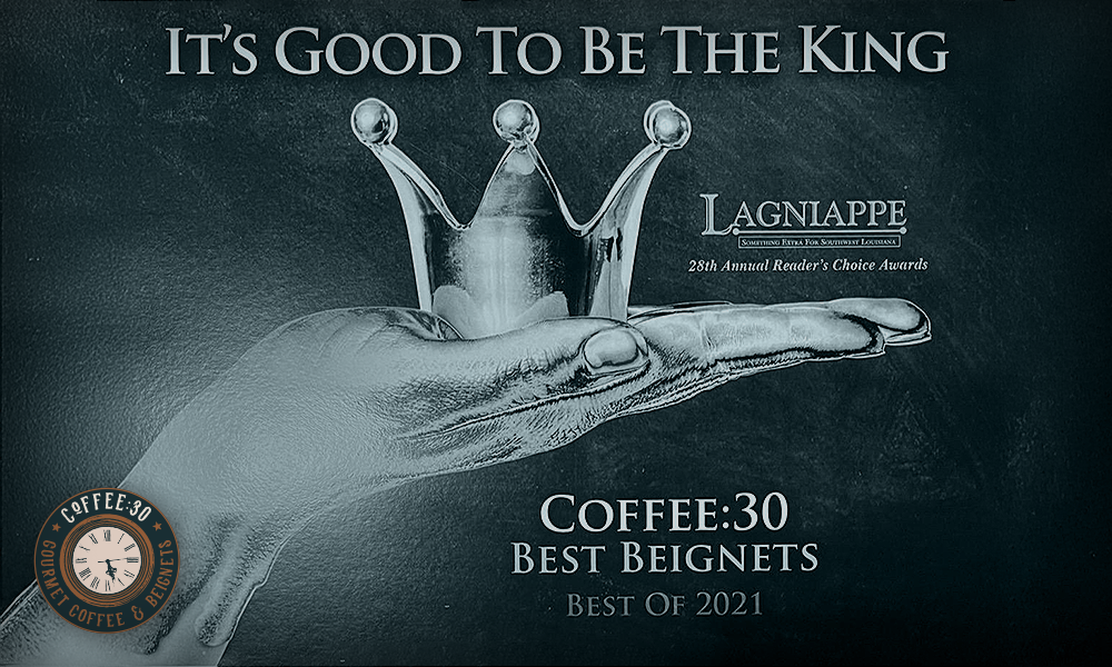 Hand holding a silver crown with text promoting Coffee:30 as Best Beignets, Best of 2021, by Lagniappe Reader's Choice Awards.