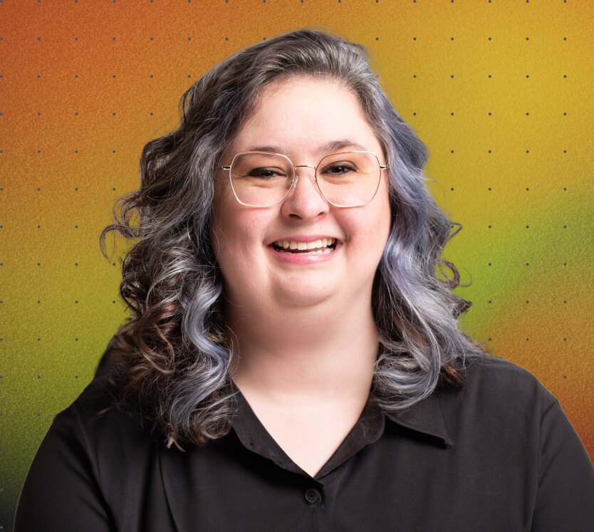 Headshot of Alyssa Gavinski, a member of the Catch Digital marketing team, smiling against a colourful background.