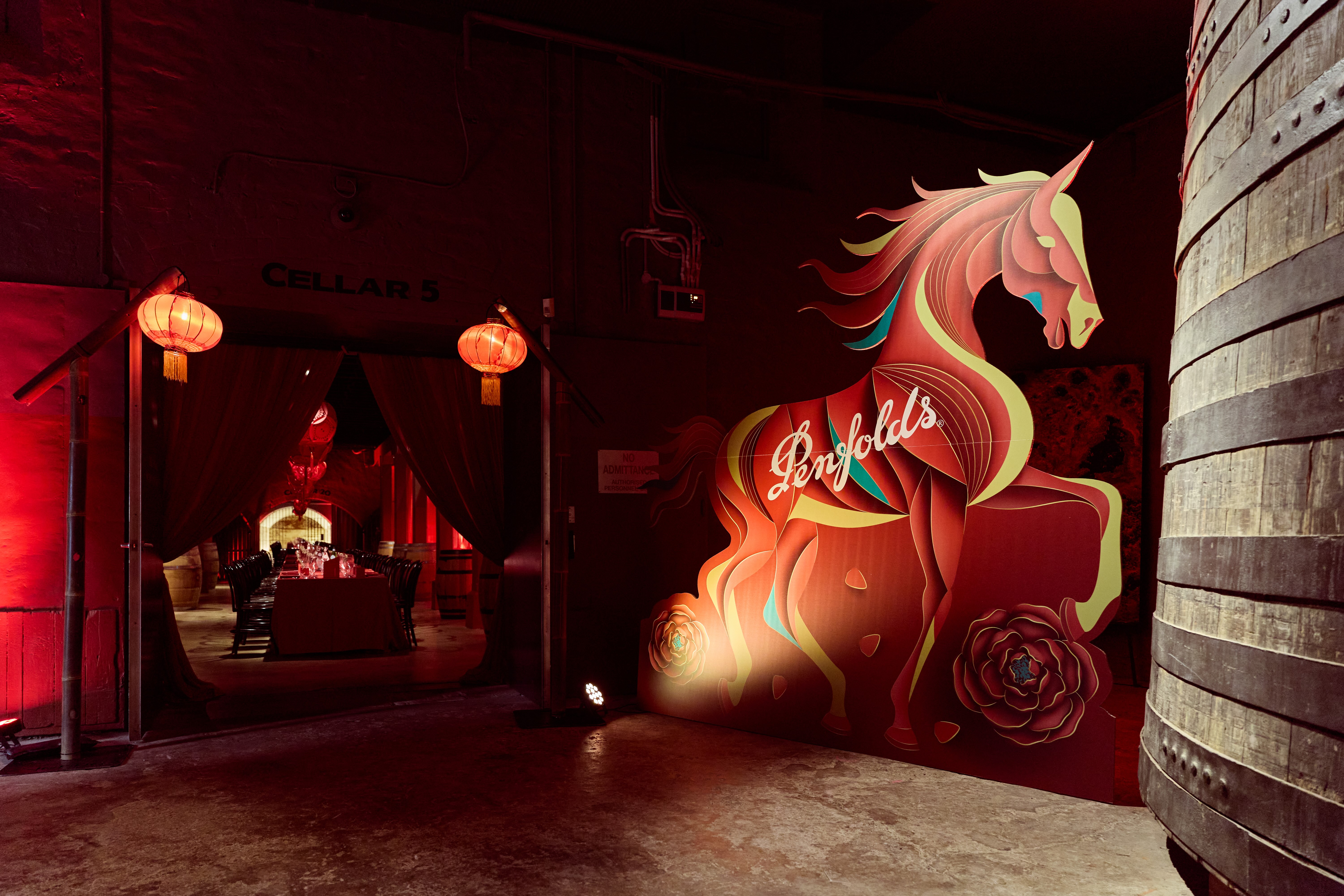 Penfolds Lunar New Year horse sculpture at cellar entrance with warm red lighting