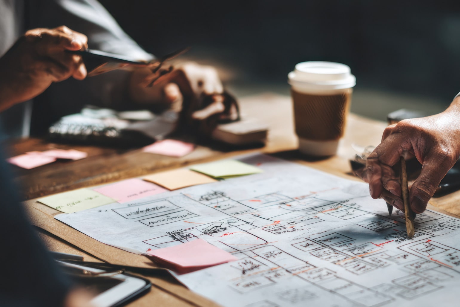 Local tourism partners collaborating on a regional marketing plan with maps and notes.