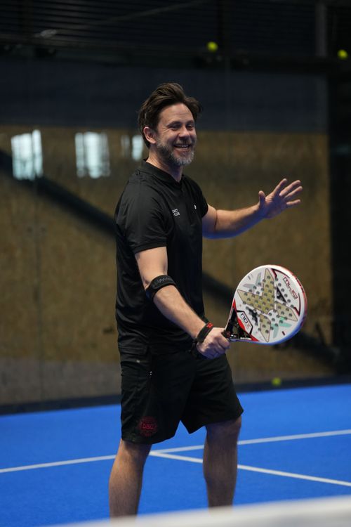 Padel balls arranged on court