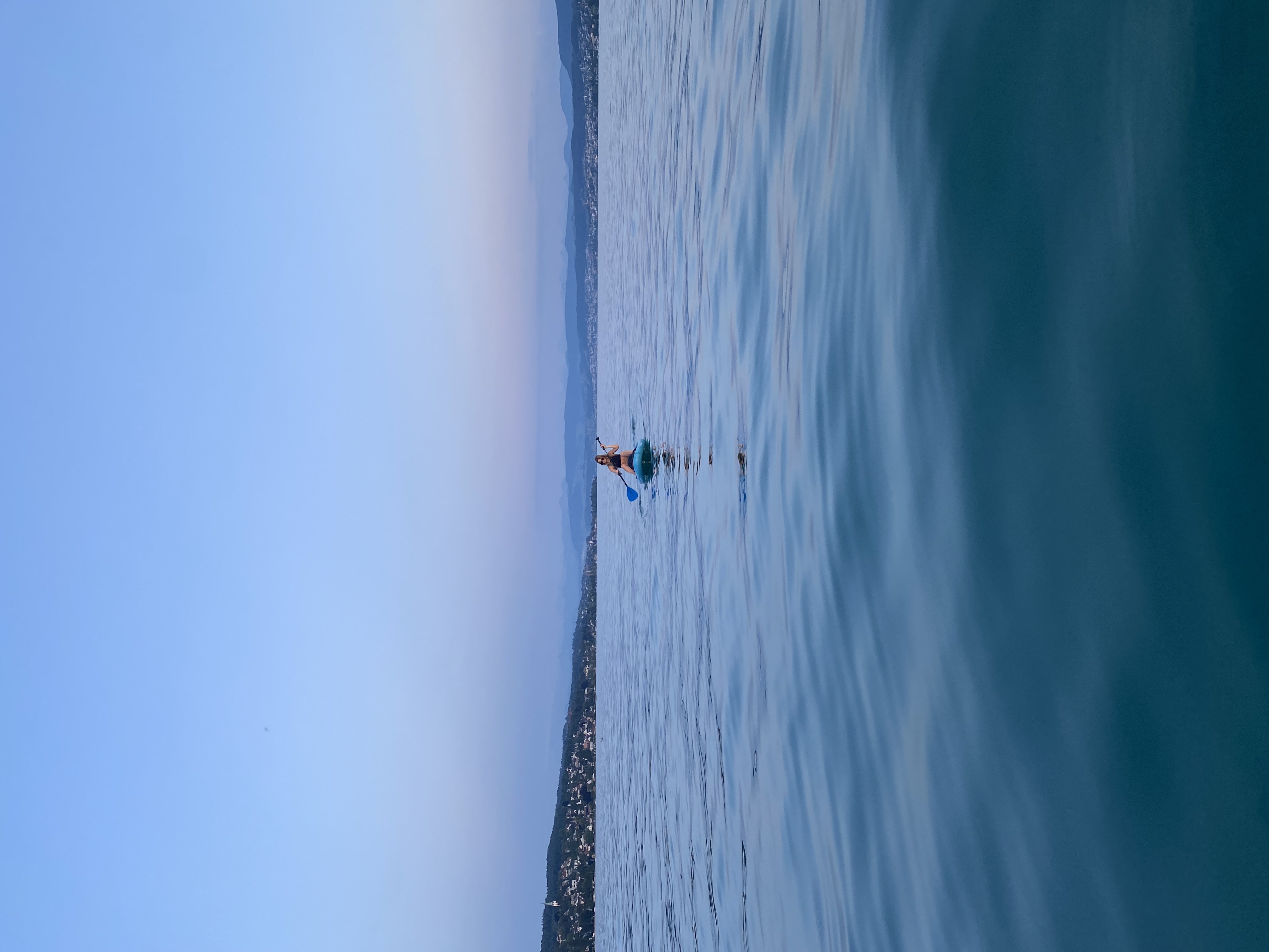 Two people on a paddleboard on Zürichsee, Zurich