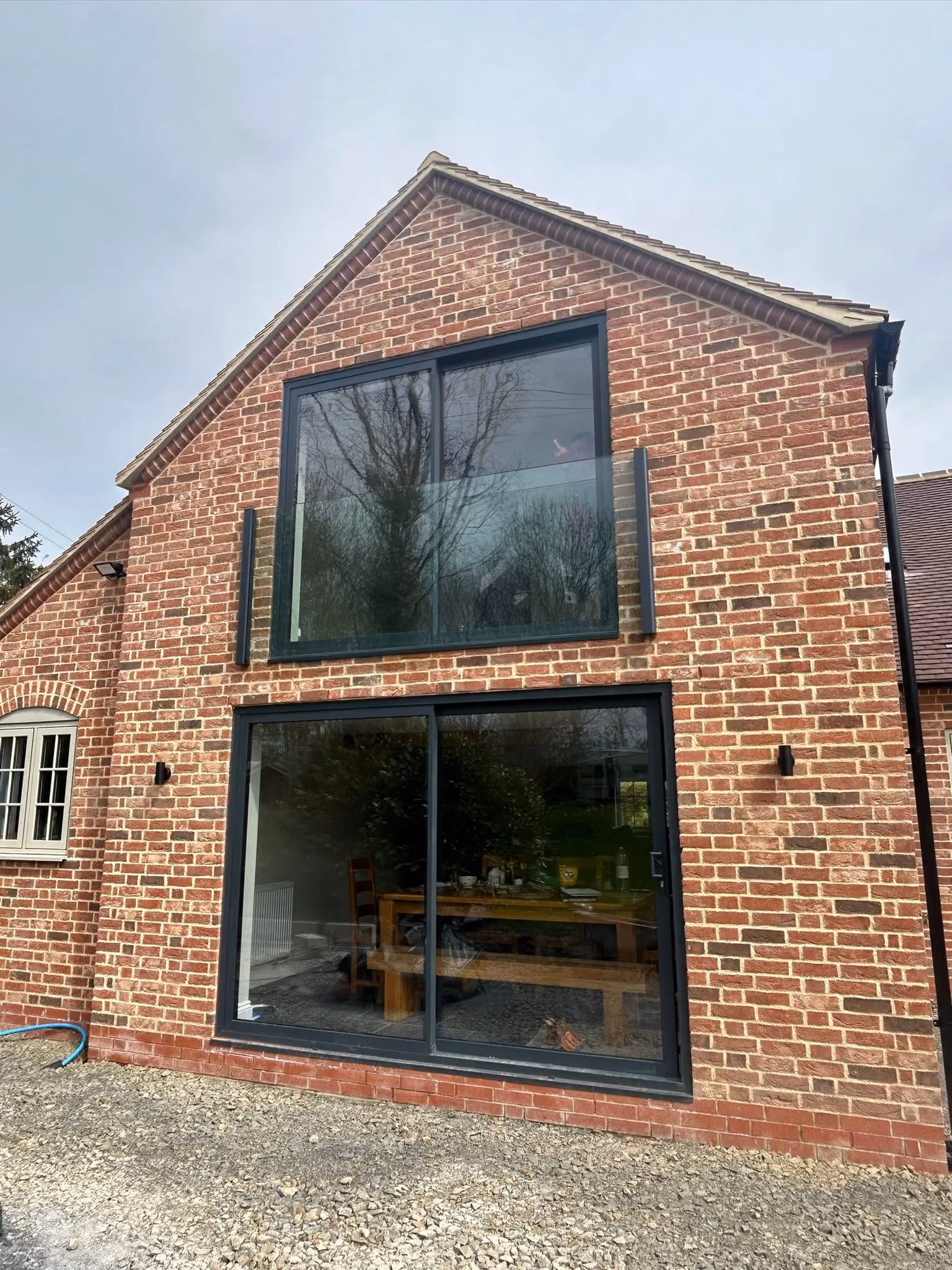 Grey aluminium door installation on a residential property
