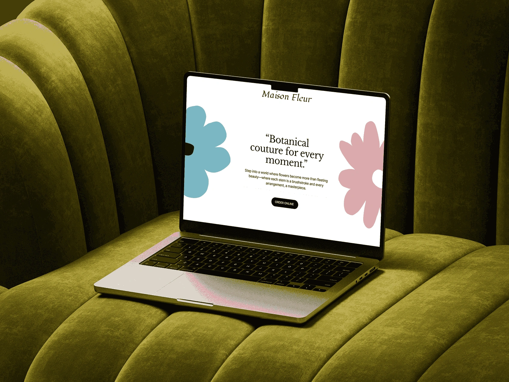 MacBook on golden green couch showing modern design
