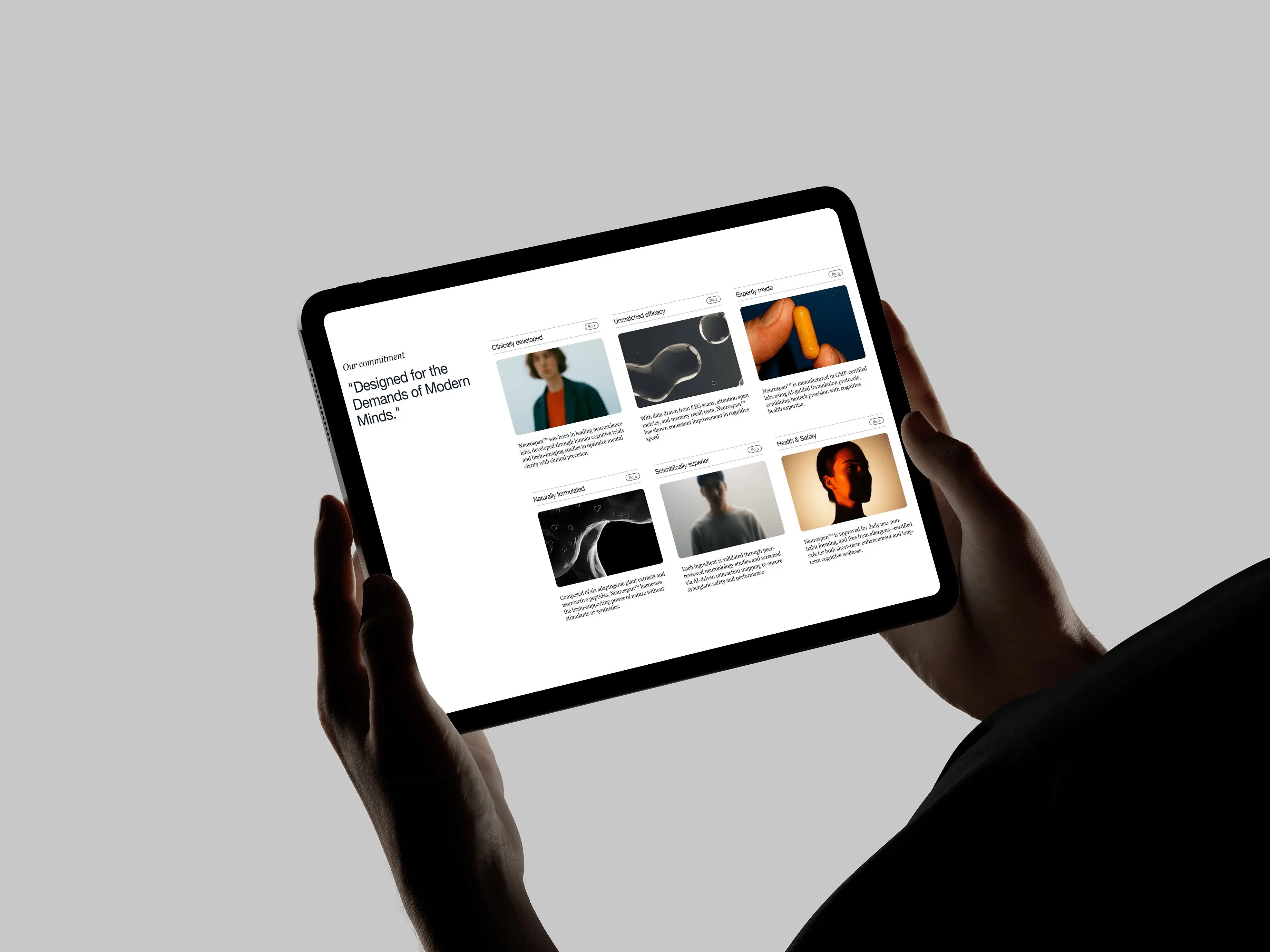 Landscape iPad held in two hands showing digital interface
