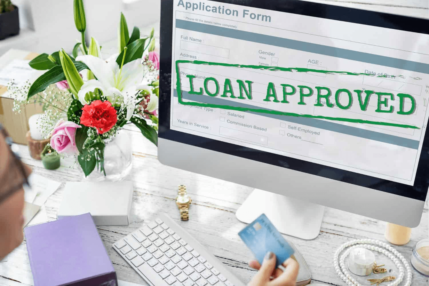 Screen displays a digital loan approval - Types of Commercial Real Estate Loans