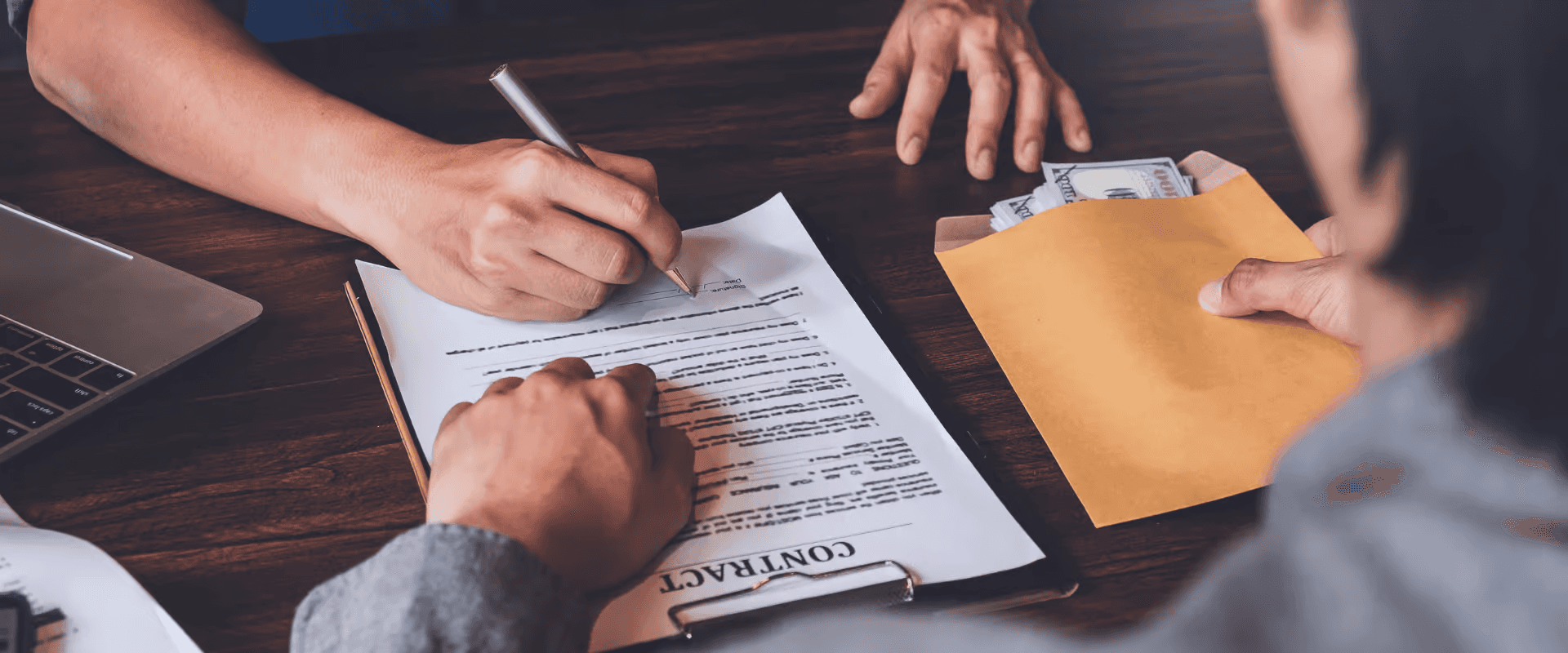 Person signing a contract - Commercial Lending Process