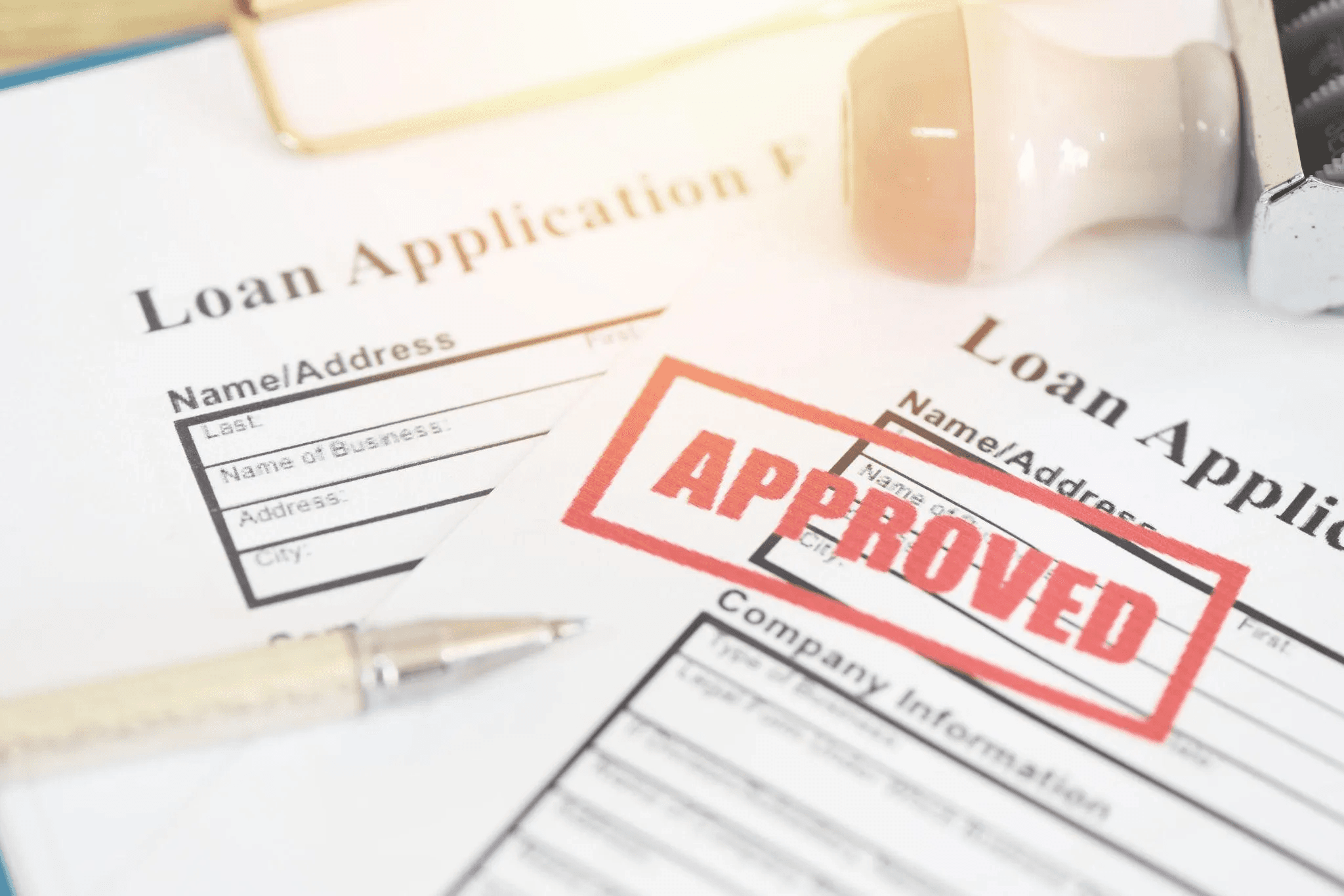 Approved loan application with red stamp - Commercial Lending Process