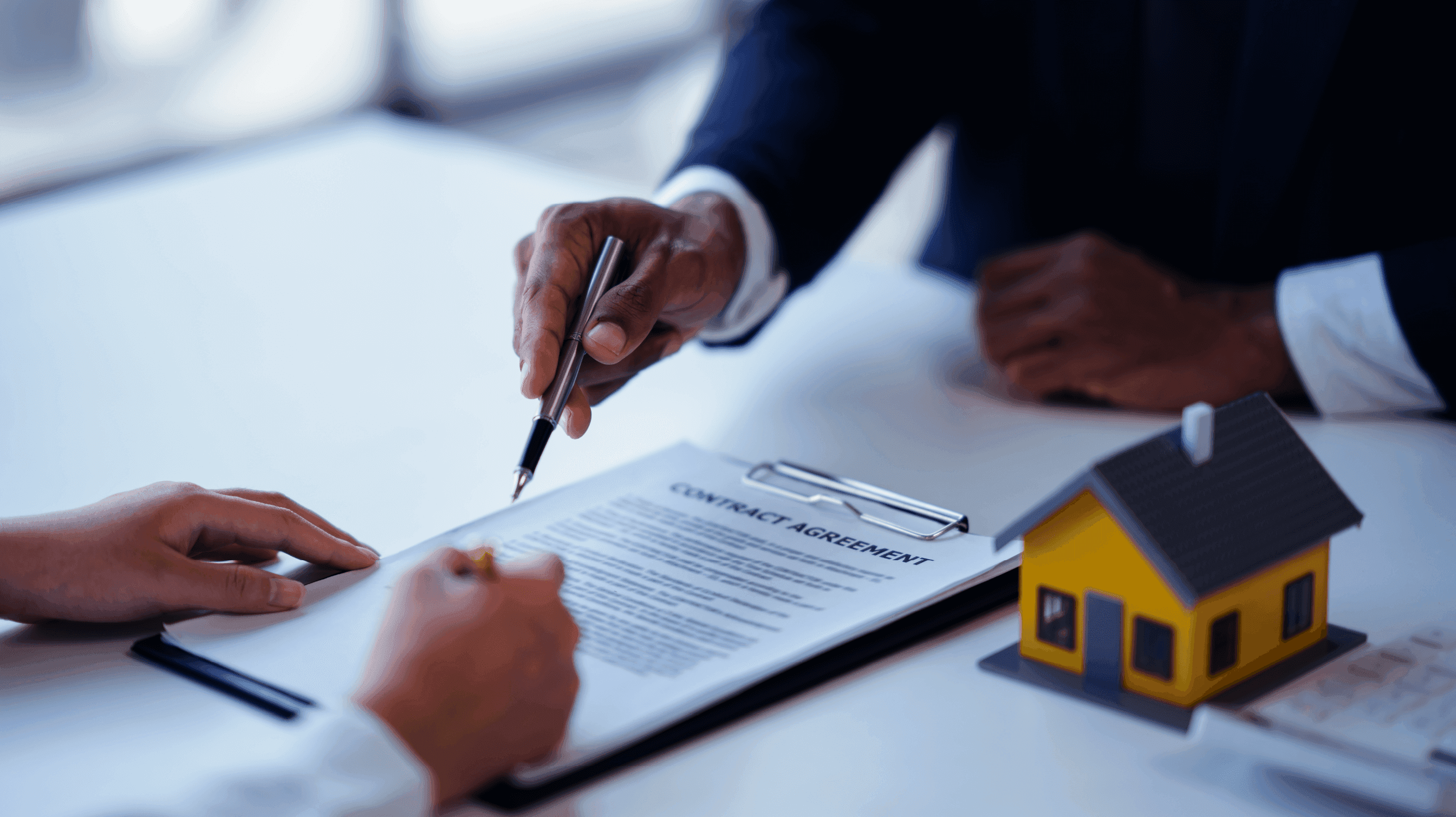 Person signing a real estate contract - Commercial Real Estate Lending Process 