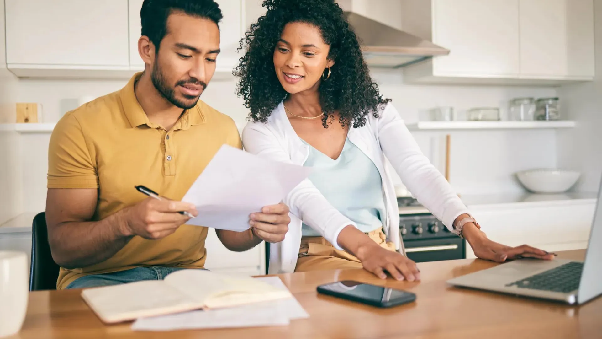 man and a woman looking at files - Debt Service Coverage Ratio Commercial Real Estate