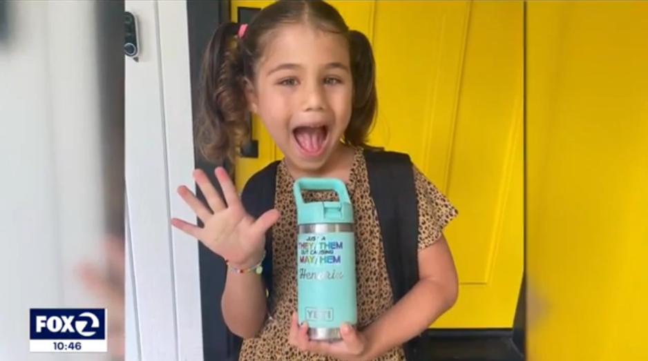 A happy transgender child poses for a photo