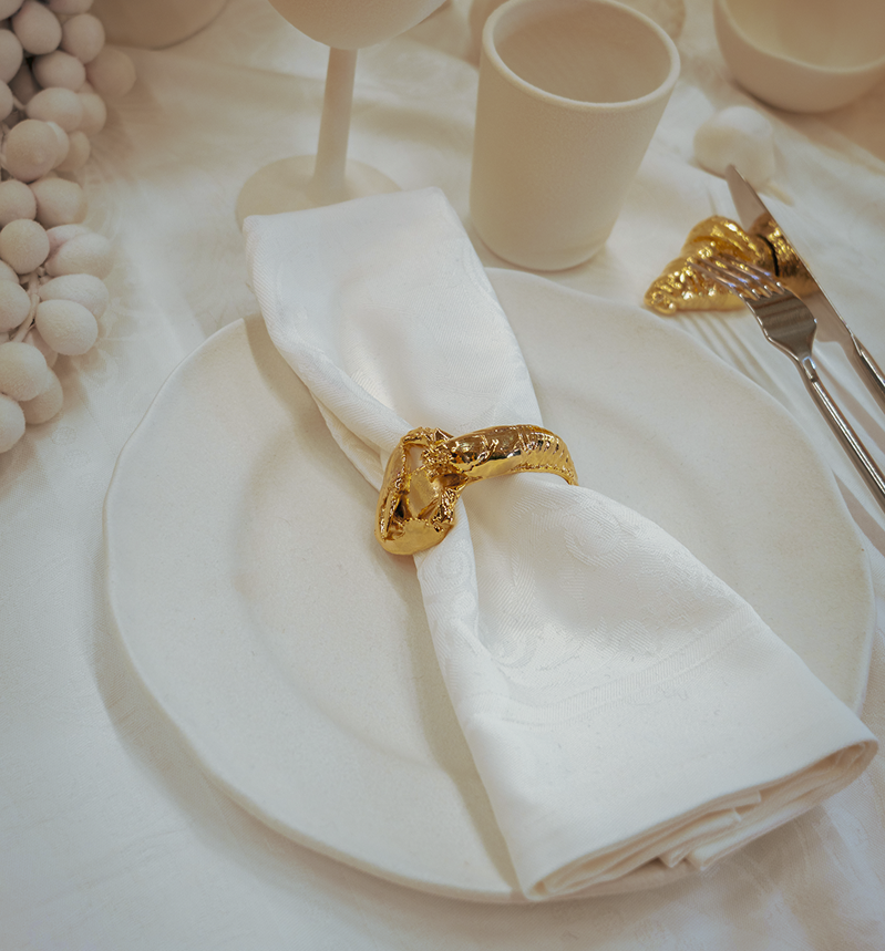 Luxury tableware made in France. Golden napkin ring in the shape of a lobster, brass napkin ring, bronze napkin ring, luxury table setting and tablescaping. Perfect for luxury tables, hospitality flatware, design or decor objects for the table. 