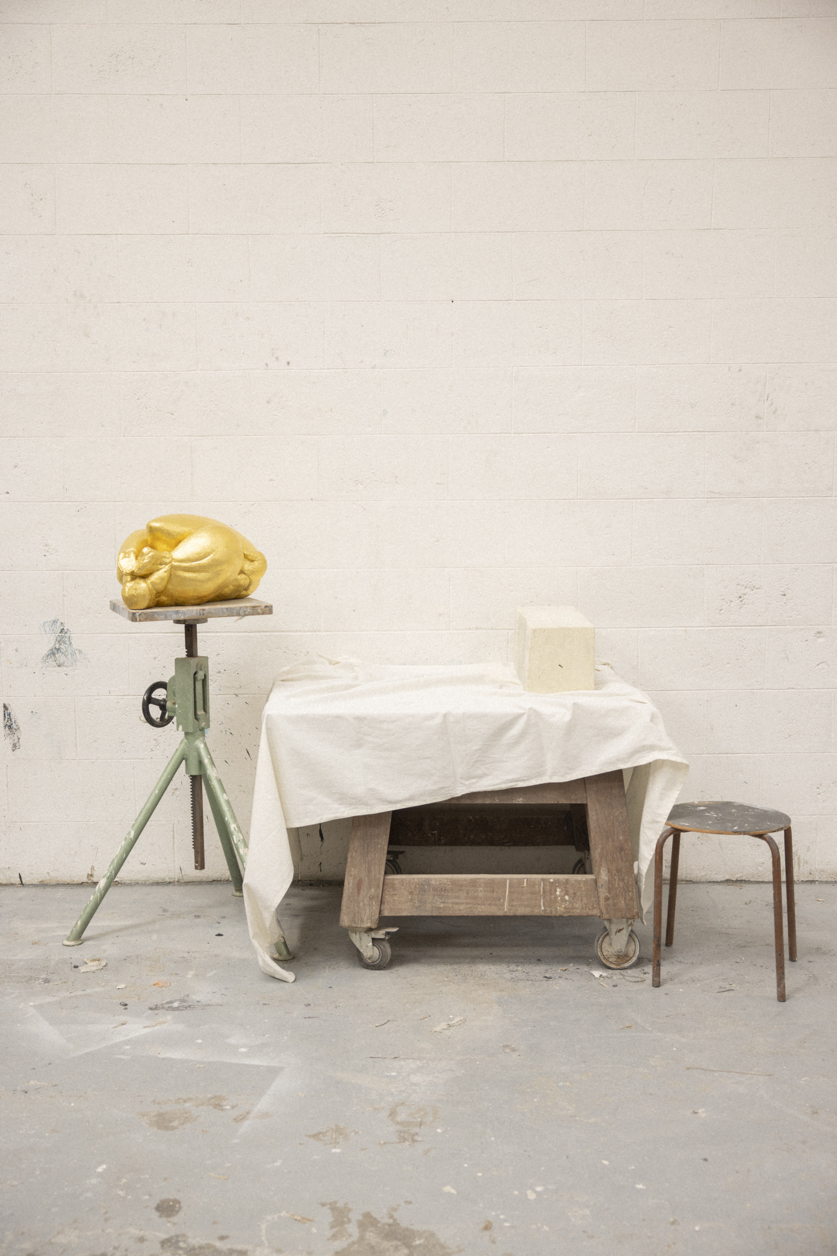 An image of the inside of the Parisian workshop Saint Chaffray and a Ferdie creation, Le Poulet, a contemporary sculpture and centerpiece, finished with gold leaf.