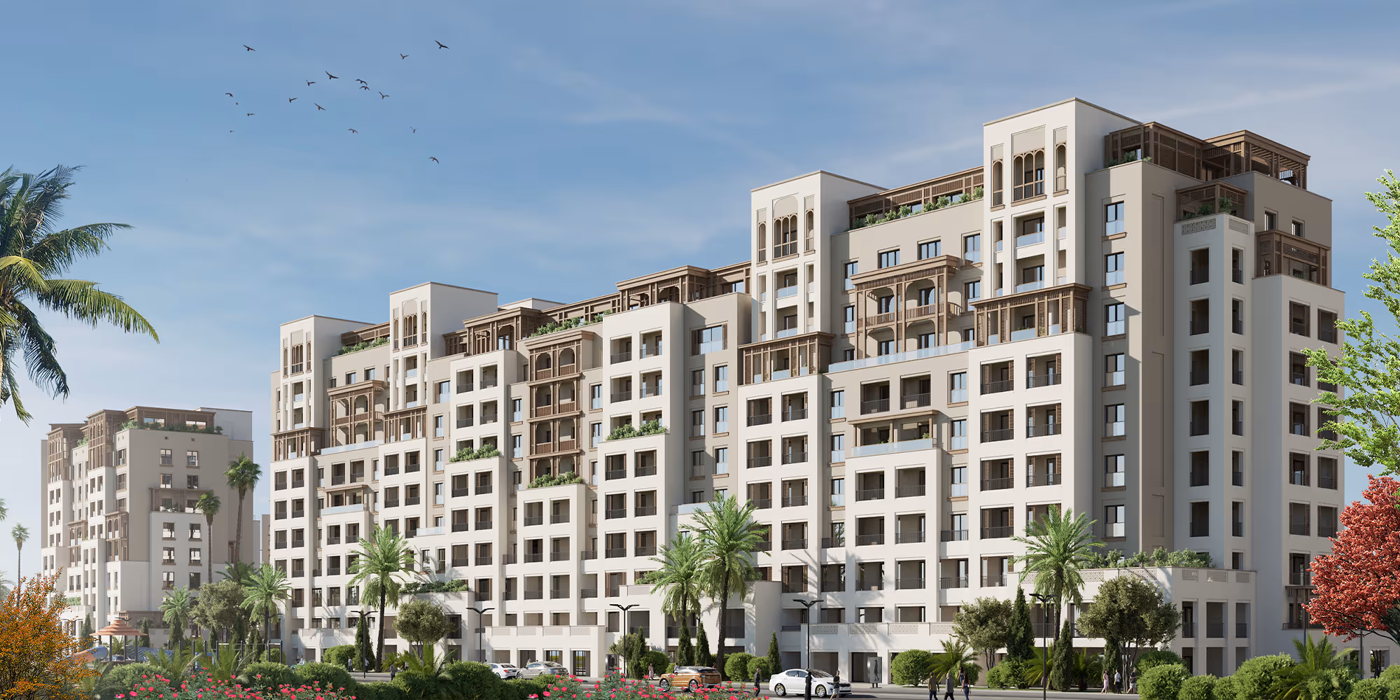 A large white building with balconies - arabian ranches