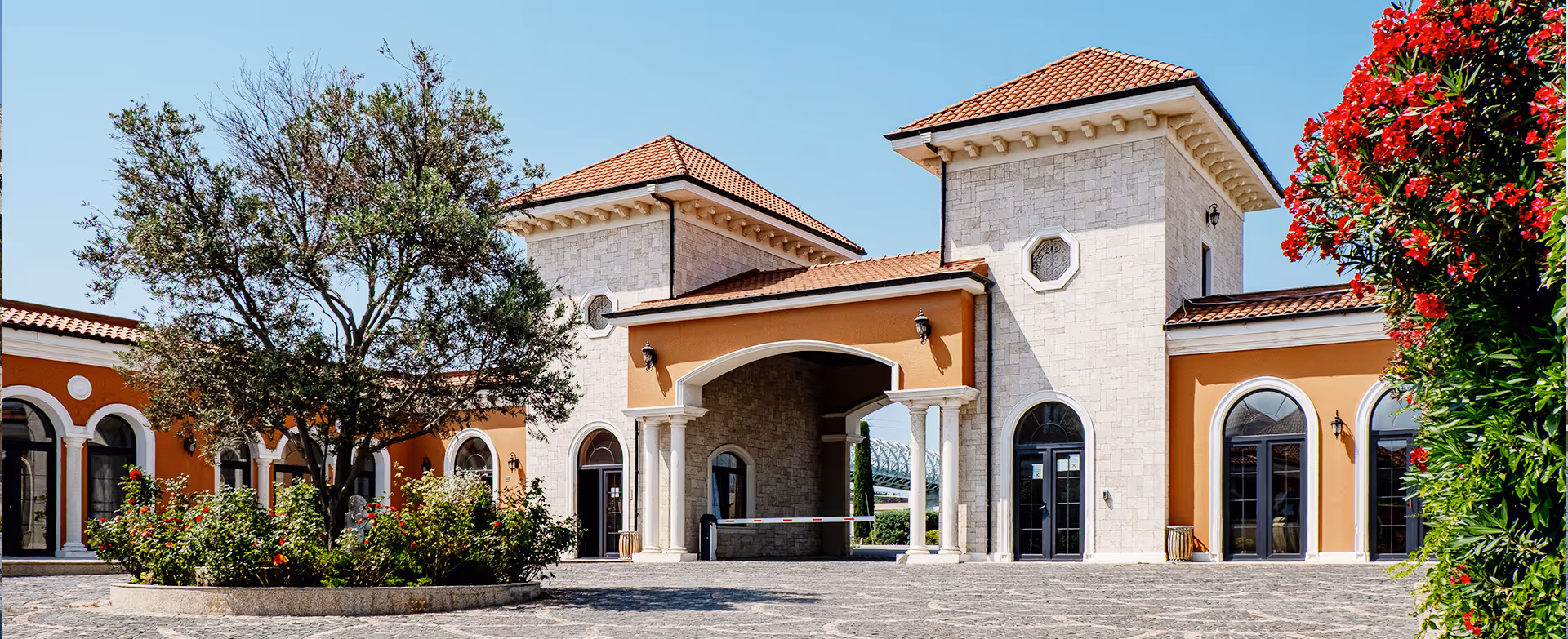 A large building with a clock on the front of it  - villa siena