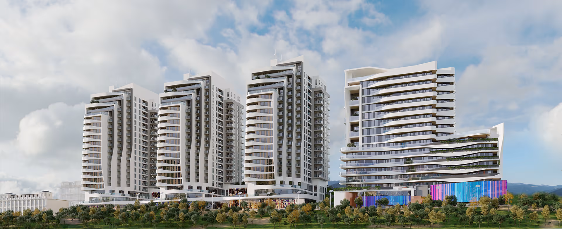 A group of tall buildings sitting next to each other  - Sabah Residence