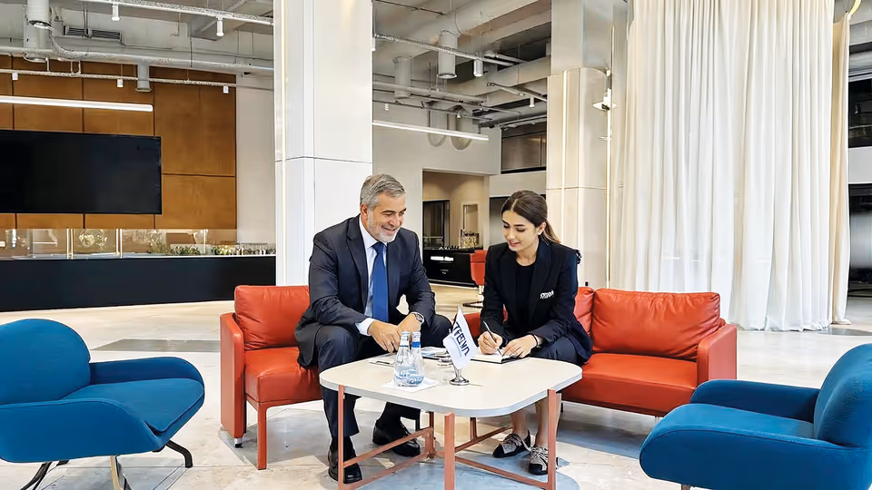 A man and a woman sitting at a table.