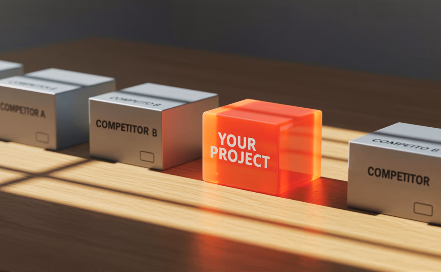 A wooden table topped with three cubes of different colors.
