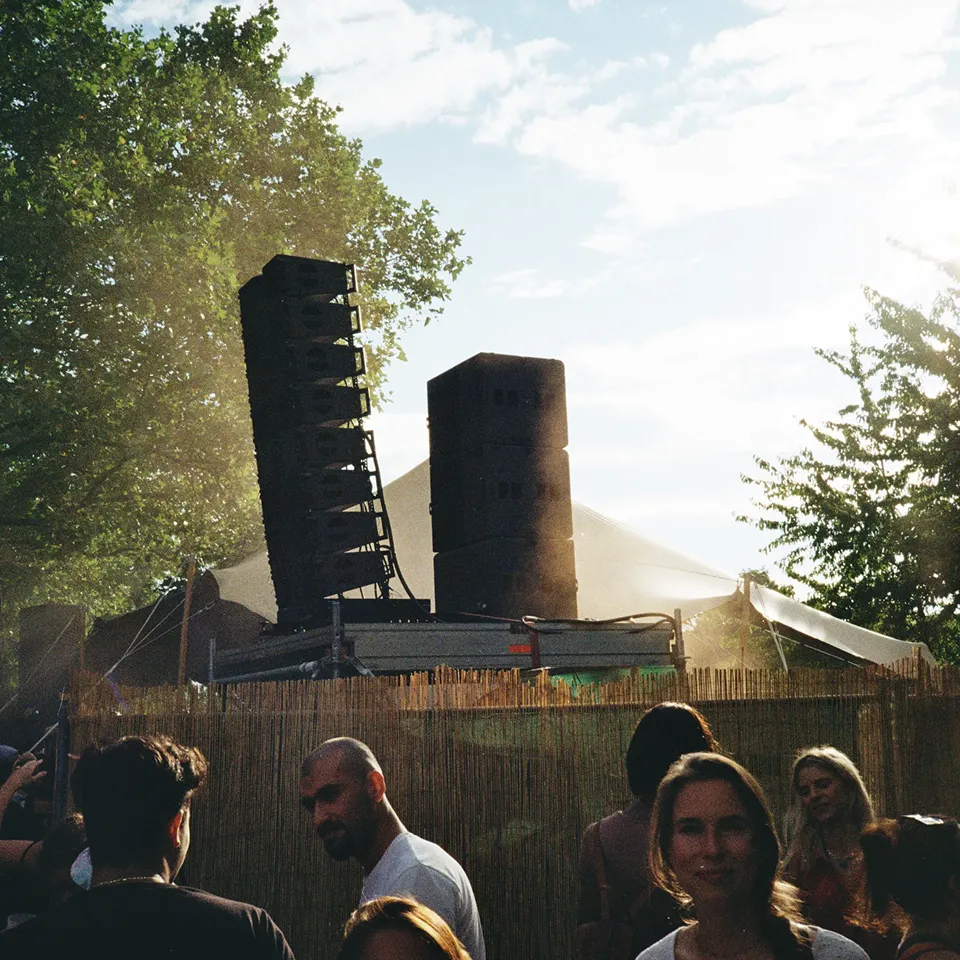 A group of people standing in front of a building.