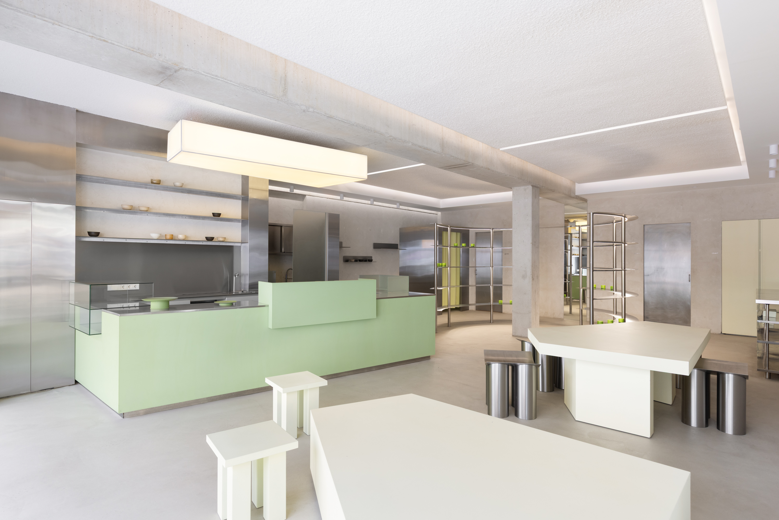 Inside the LERA Matcha flagship store in Amsterdam, with the green counter