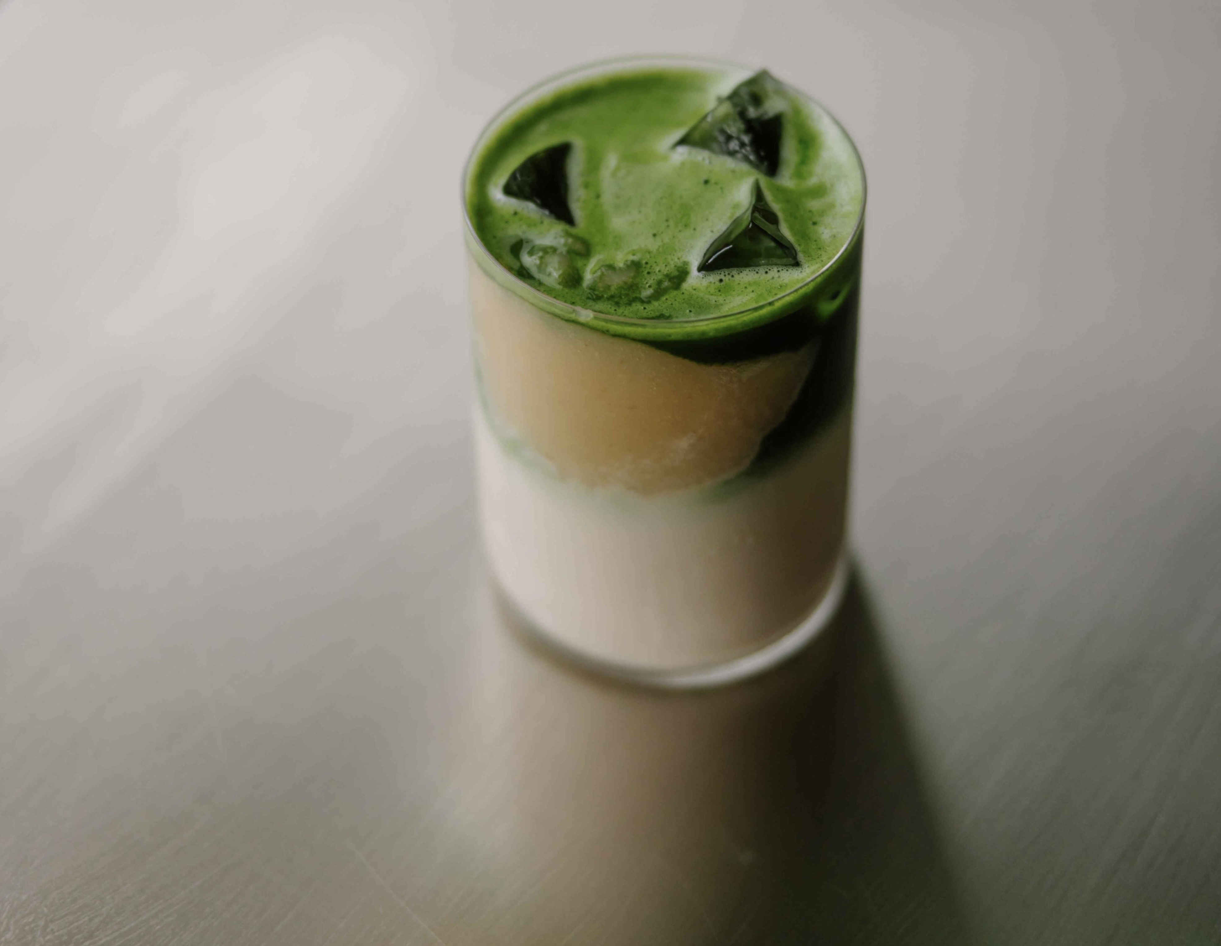 Earl Grey and pear iced matcha in a glass