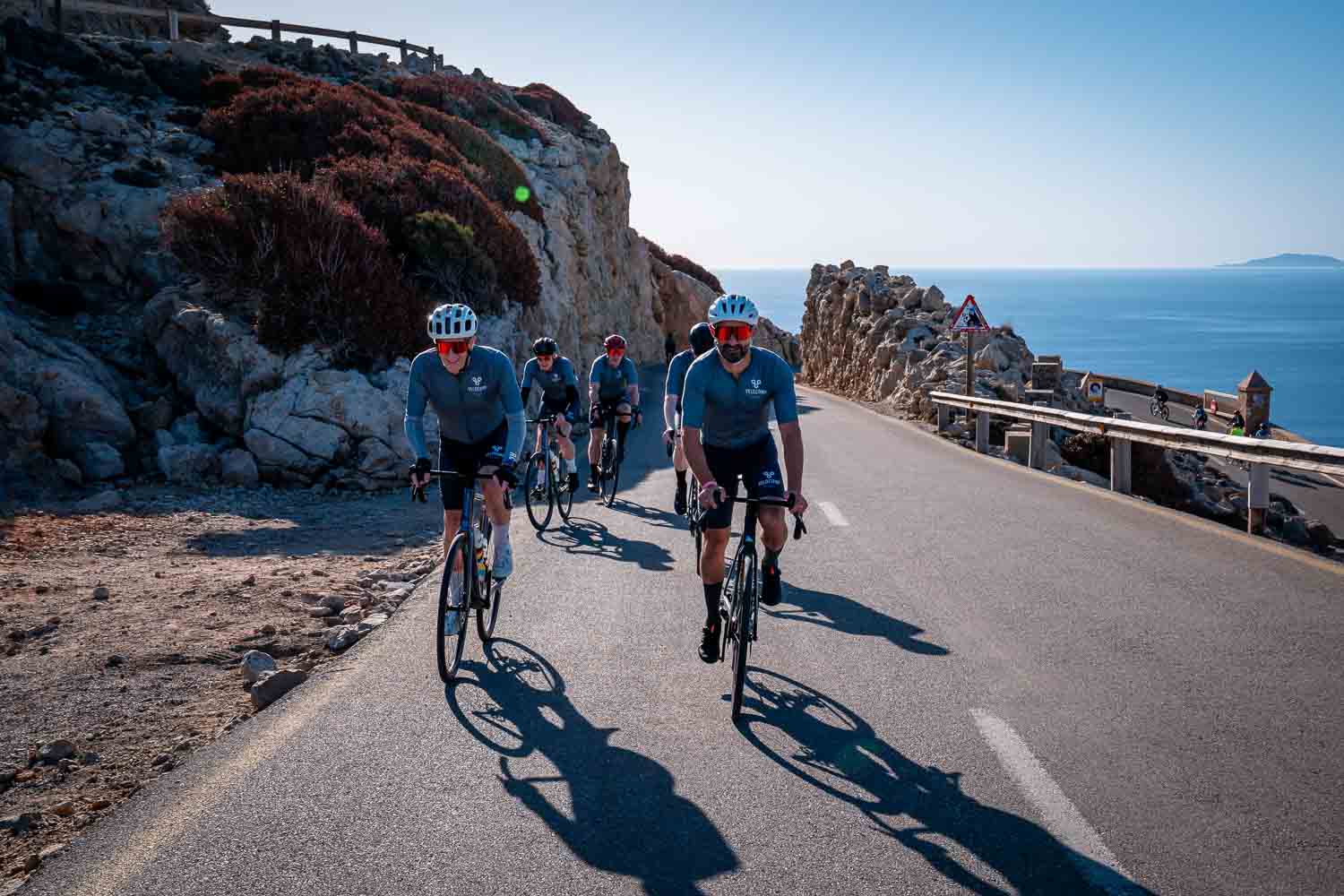 Cyclists leaving Formentor lighthouse