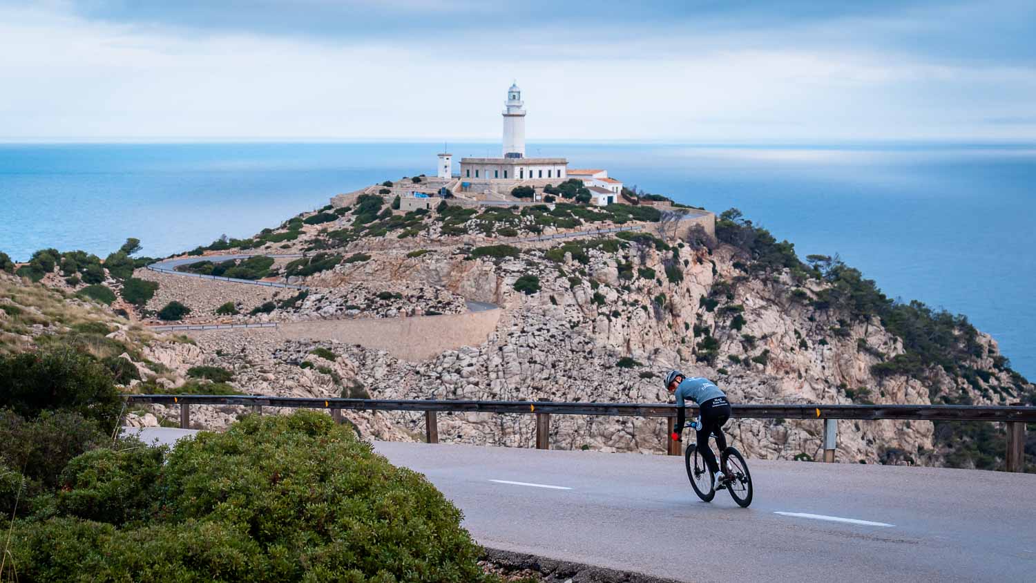 Rider with lighthouse behind