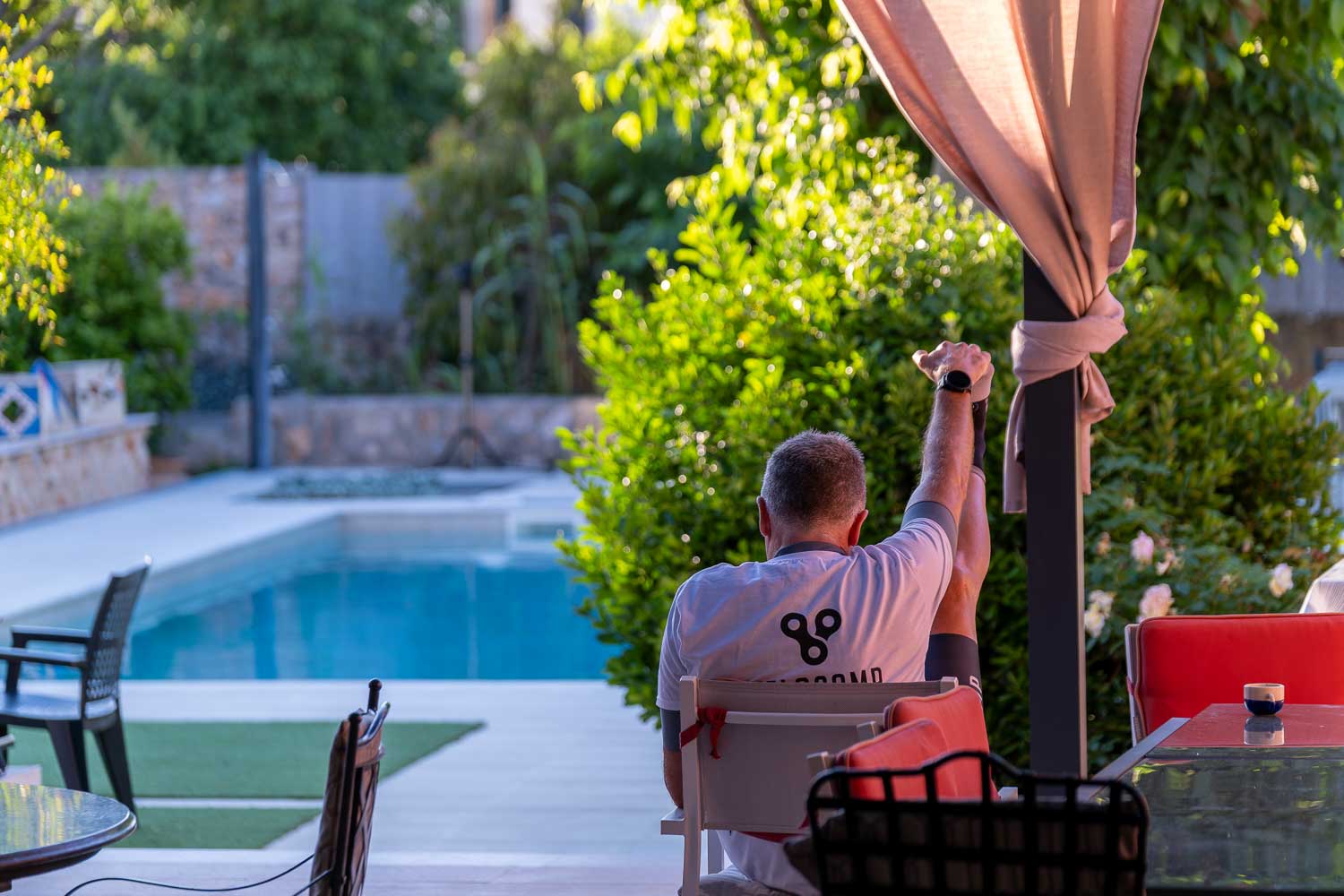 Velocamp rider stretching at pool