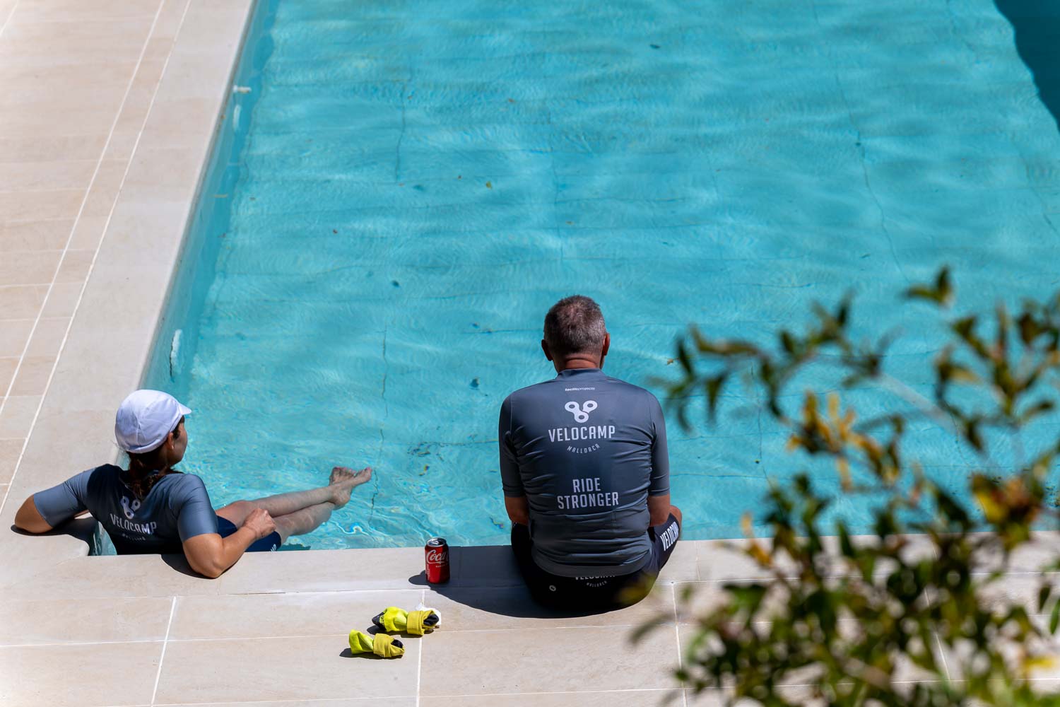 Two guests relaxing by Velocamp pool