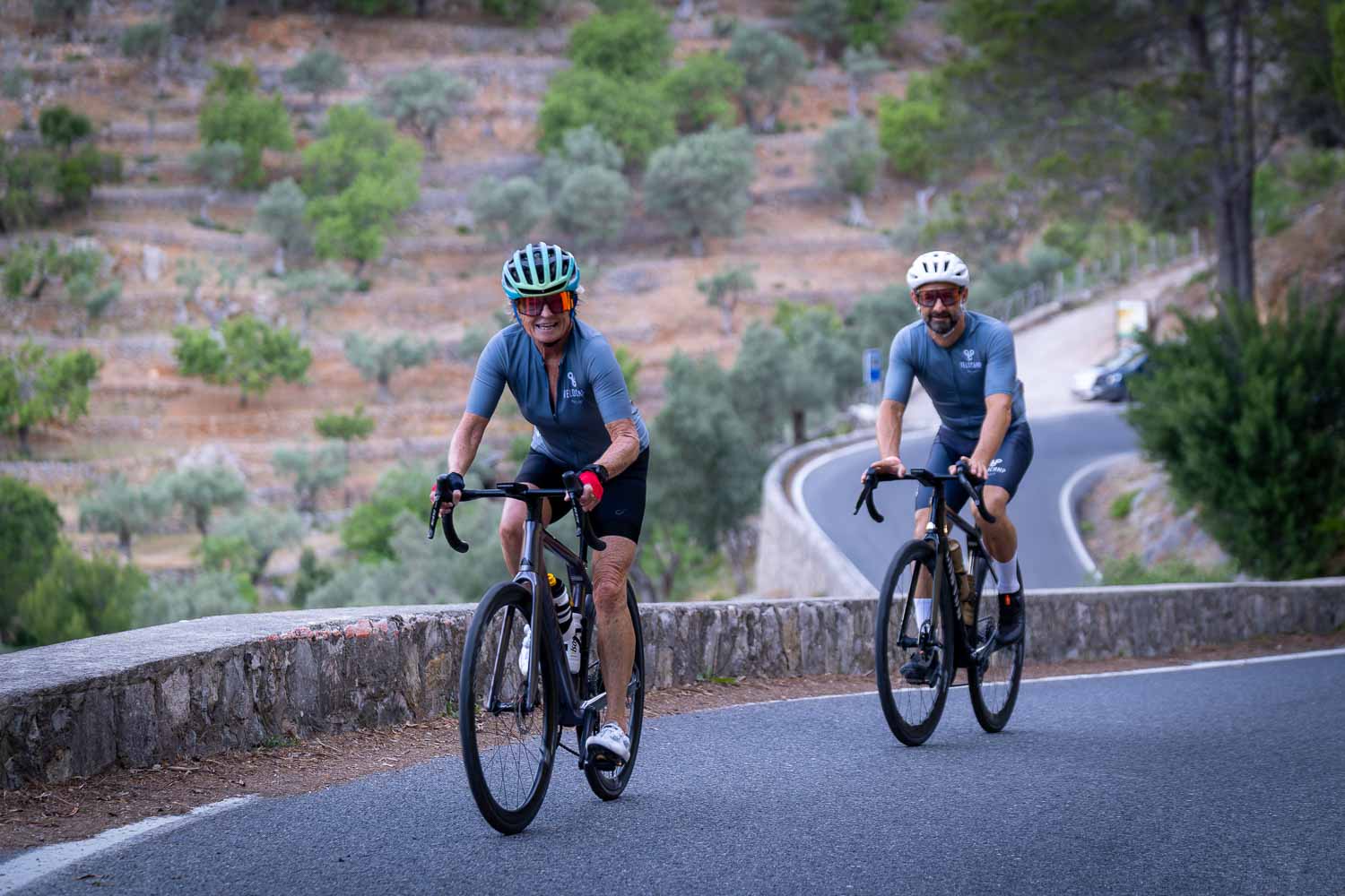 Two cyclists climbing together Mallorca