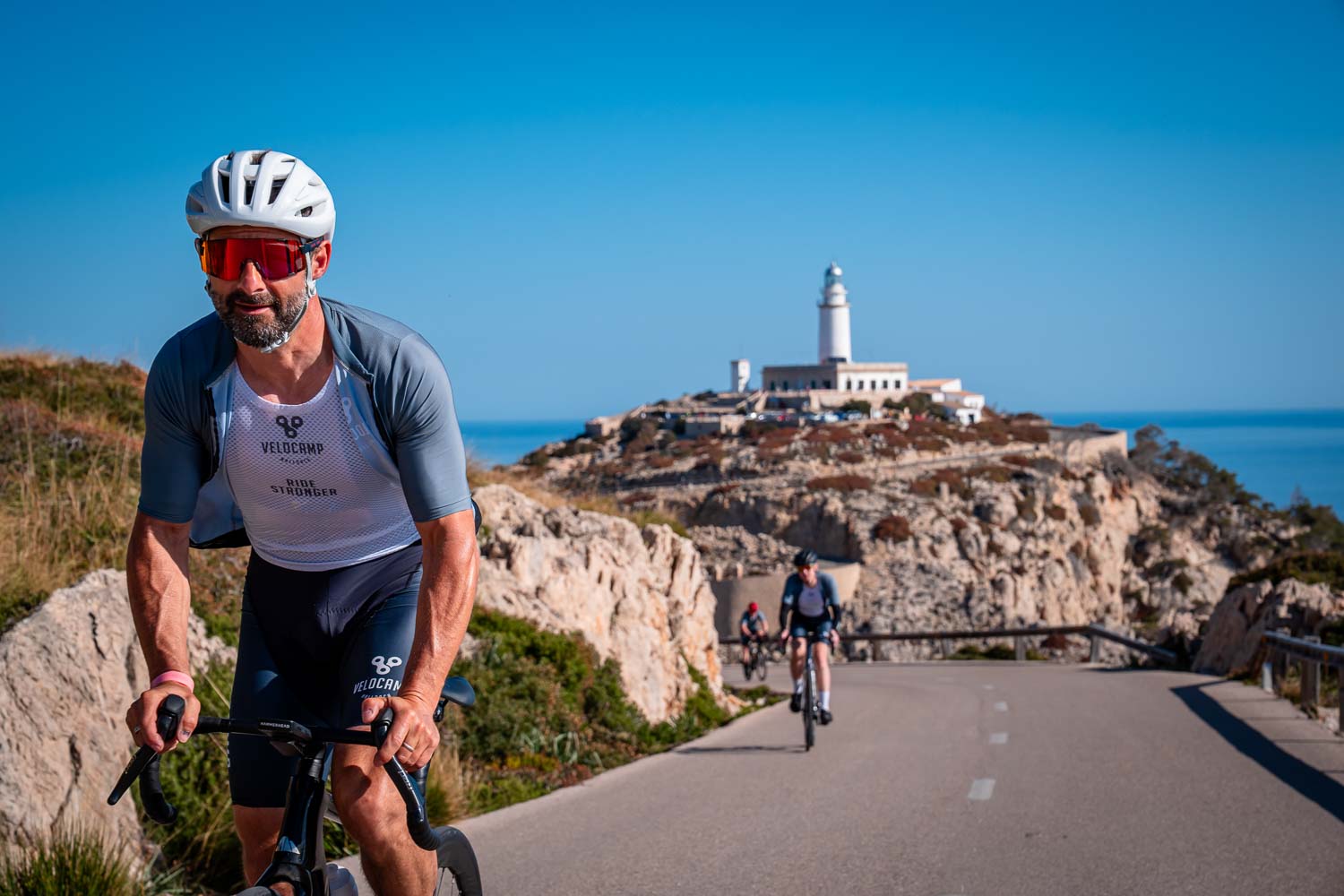 Cyclist standing on ascent