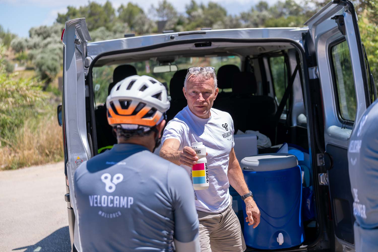 Team van passing a bottle