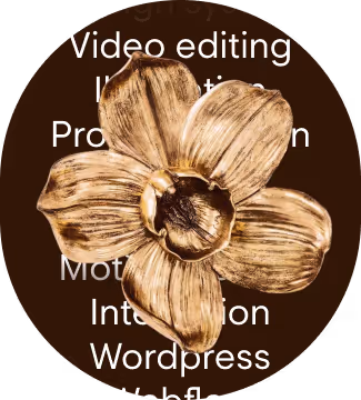 Golden metallic flower with petals displayed over partially visible white text on a dark circular background.