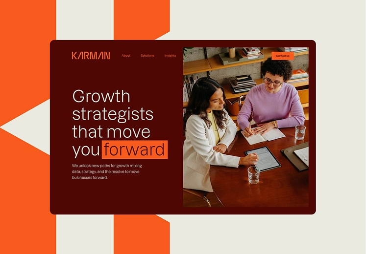 Website banner showing two women discussing data and strategy at a table, with text: Growth strategists that move you forward.