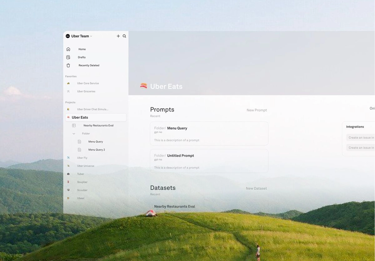 A person standing on a green hill with a narrow path leading to a small tent, with misty mountains in the background.