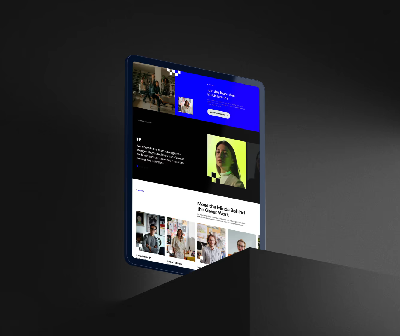 Tablet screen displaying a modern website with team photos, a quote, and a section titled 'Meet the Minds Behind the Great Work.'