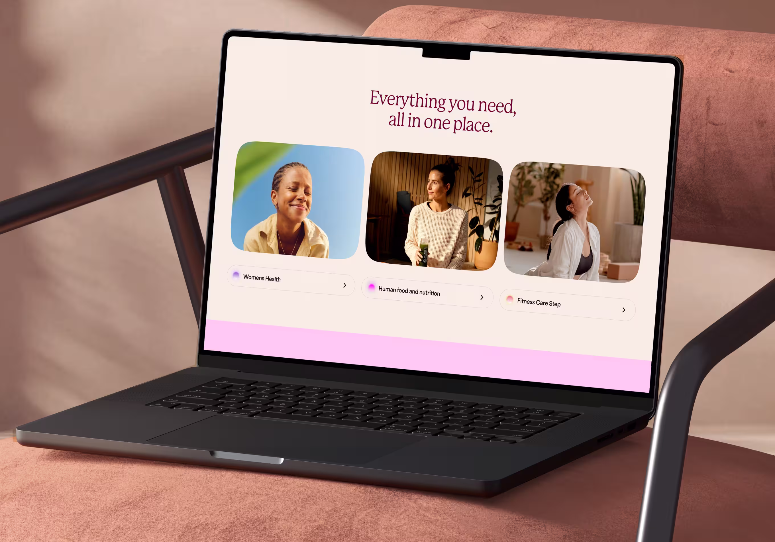 Laptop on pink chair displaying a website with the text 'Everything you need, all in one place' and sections for Women's Health, Human food and nutrition, and Fitness Care Step, each with photos of women.