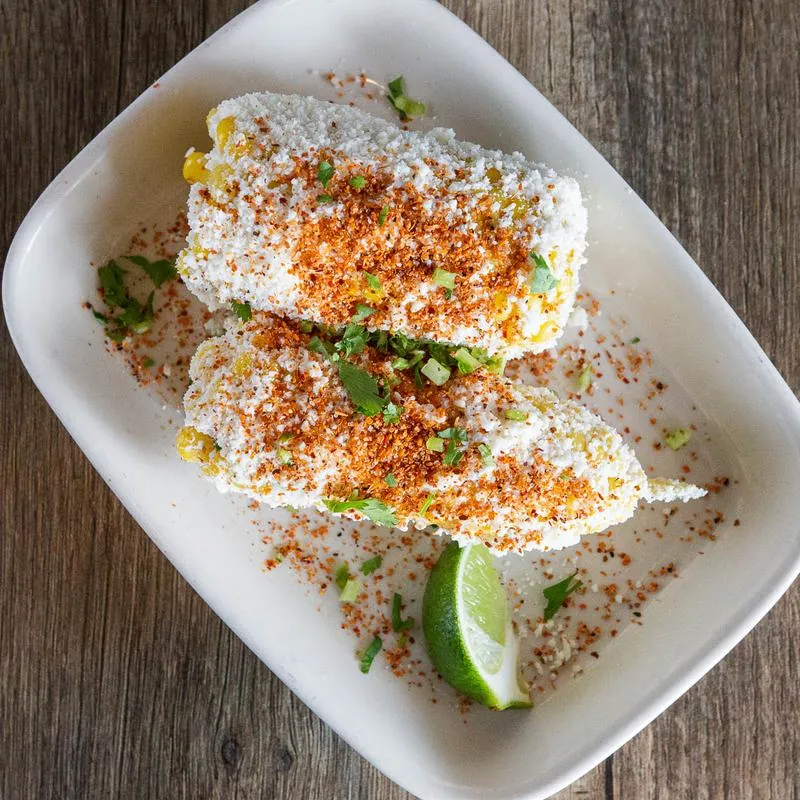 Boiled Corn with butter, cream, chesse, chilli and lemon