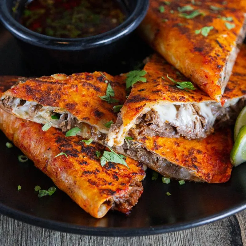 Chimichangas with meat and red sauced