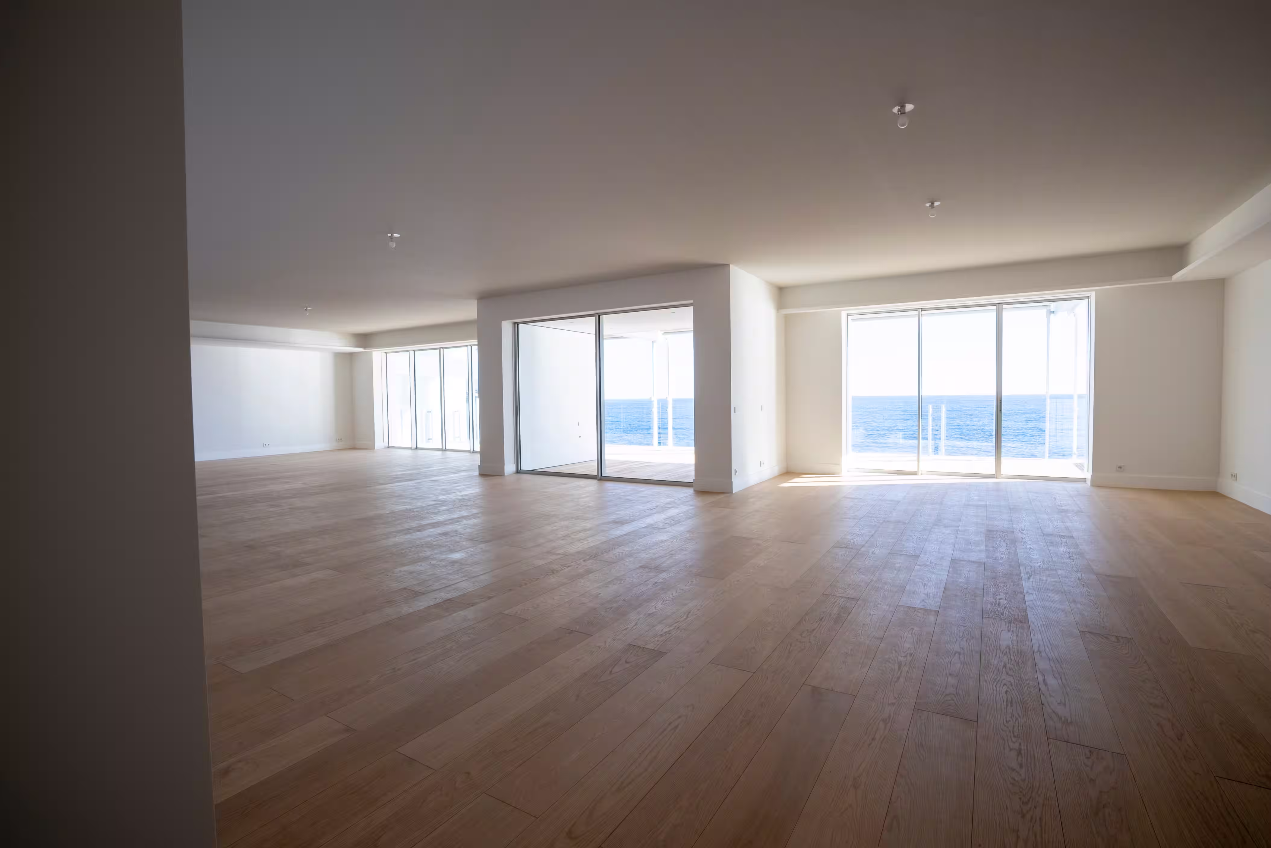 View of a large living room with sea view in Monaco