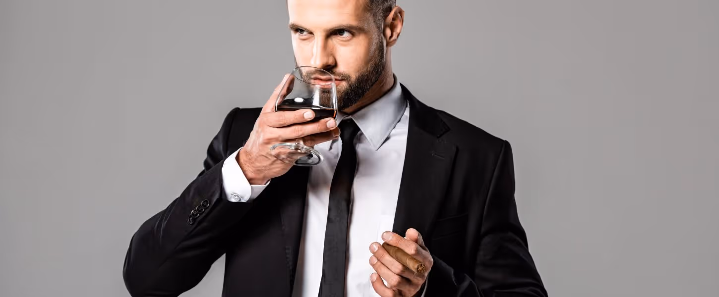 Handsome,Businessman,In,Black,Suit,Drinking,Whiskey,Isolated,On,Grey