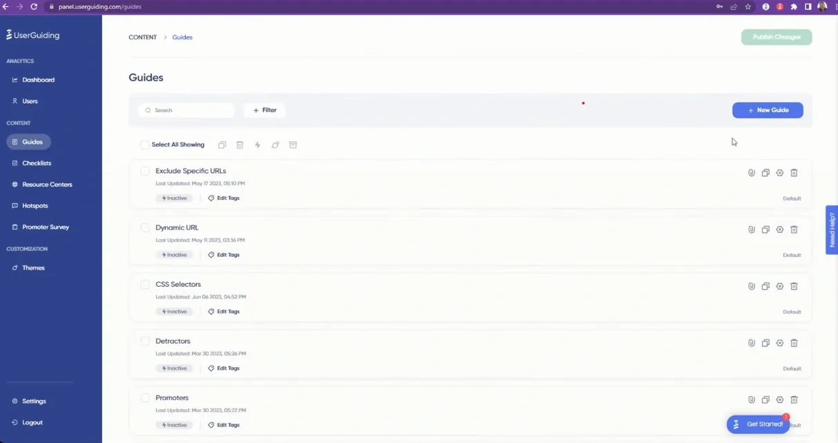 UserGuiding dashboard displaying a list of product guides with editing and tagging options.