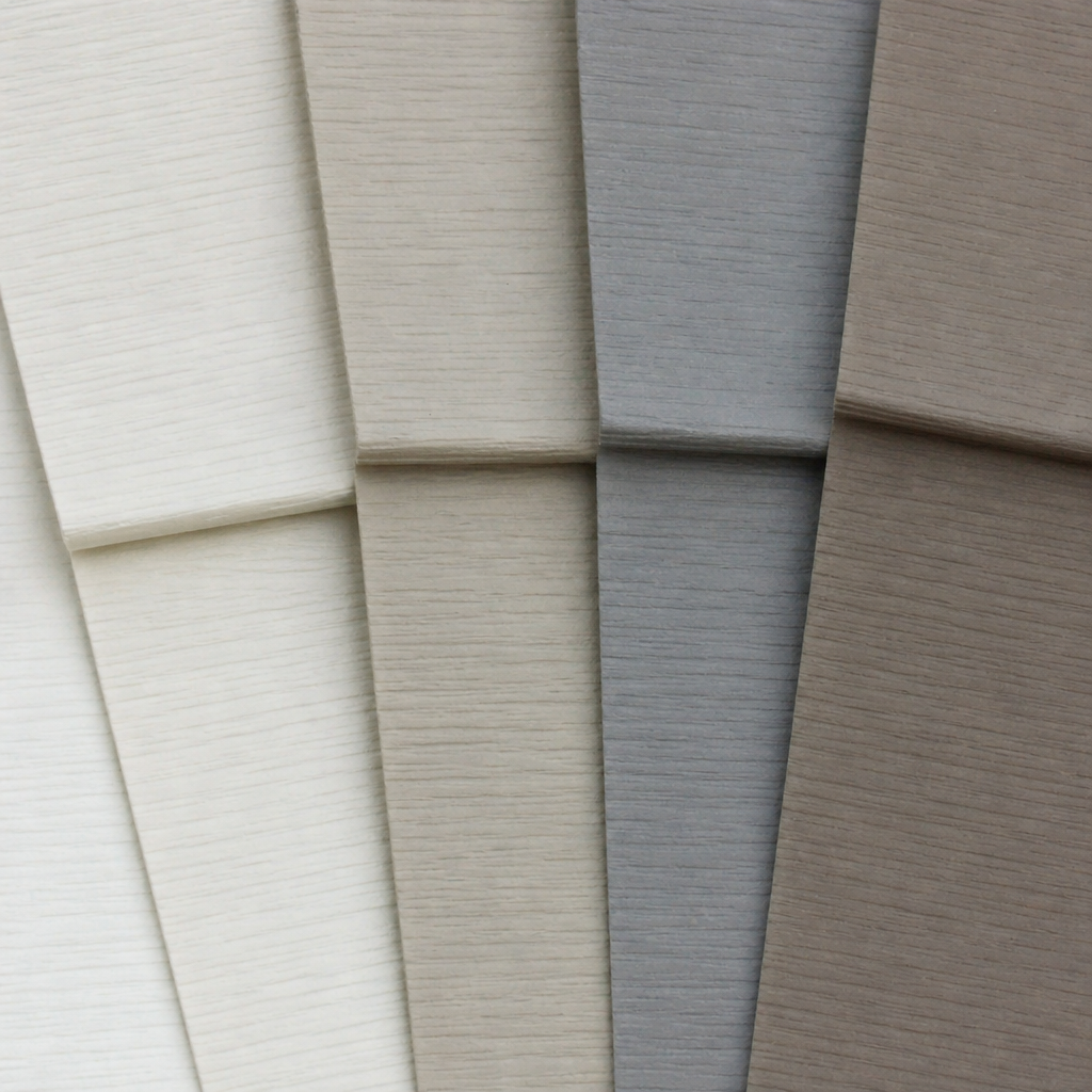 close-up of siding material samples in neutral colors