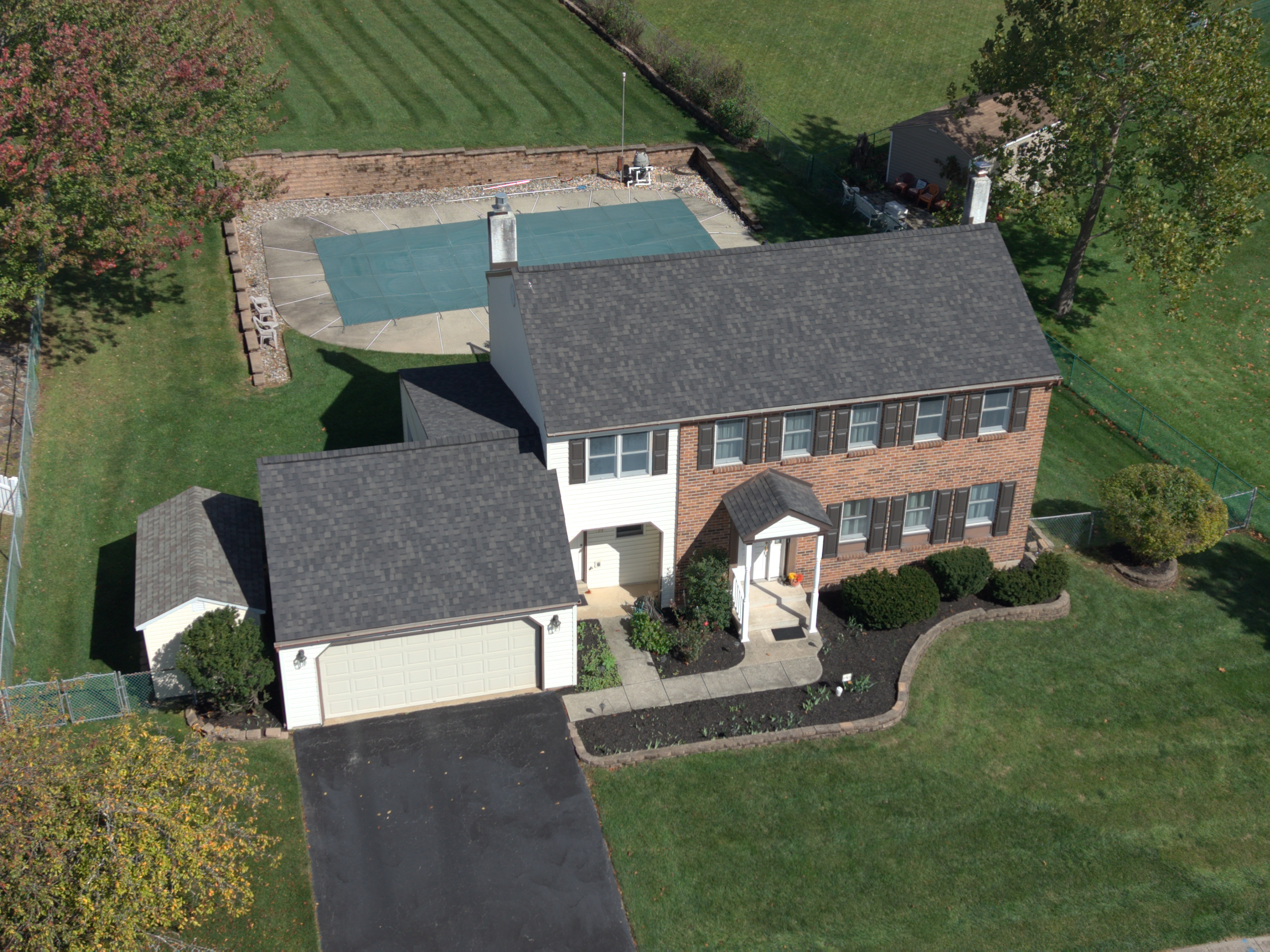 image of house in norristown pa with finished asphalt roof replacement completed by volpe enterprises