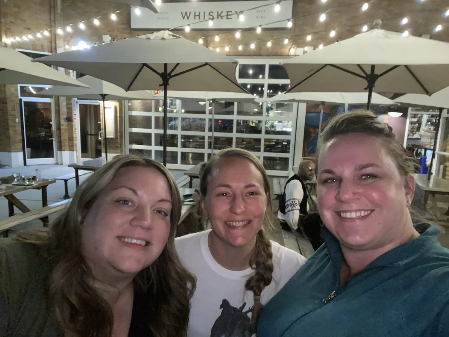 Three women posing for a photo.