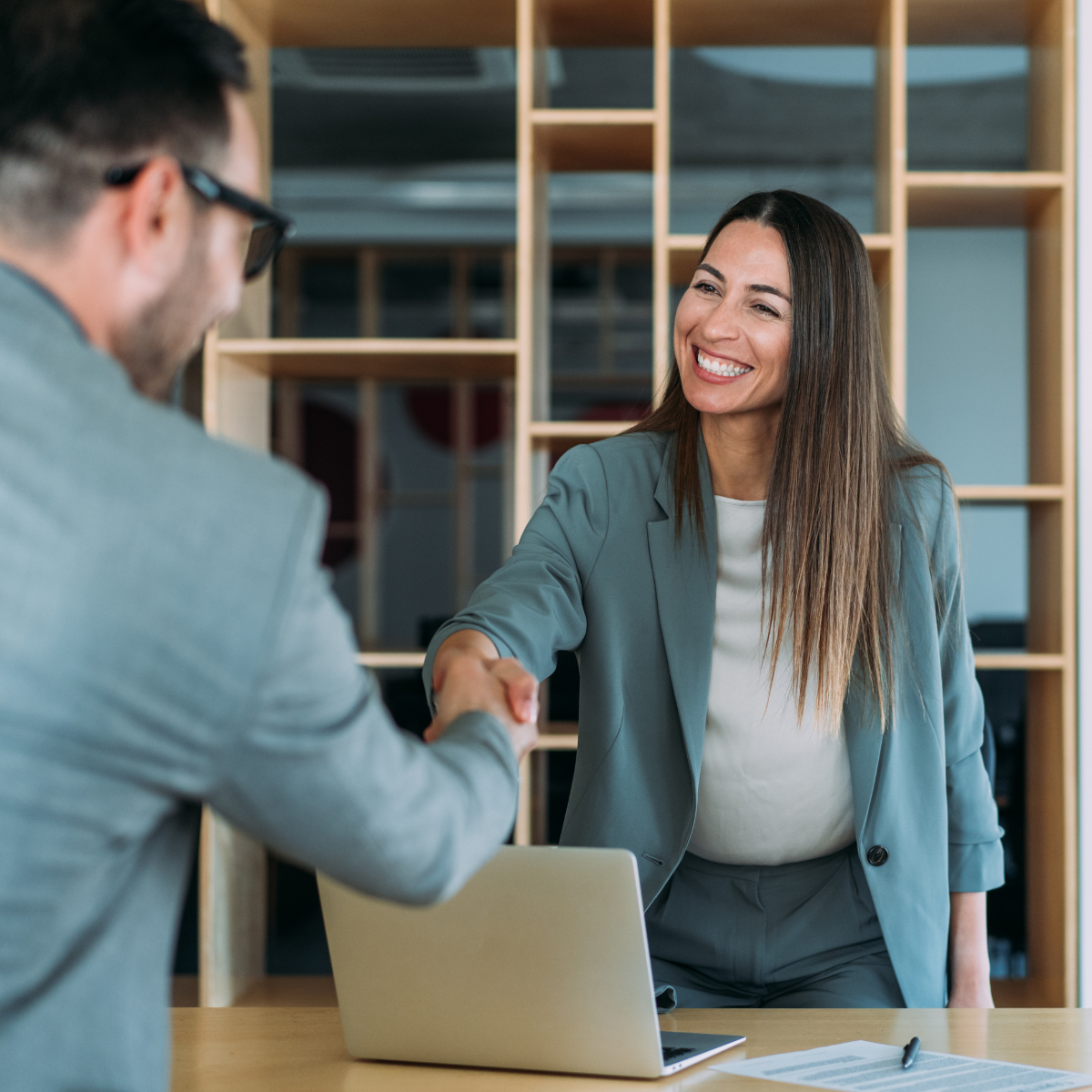 Two people shaking hands.