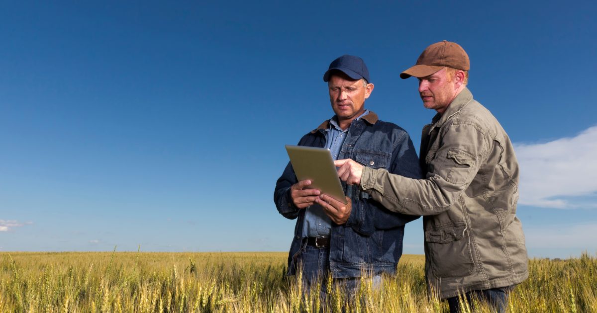 farmers with tablet