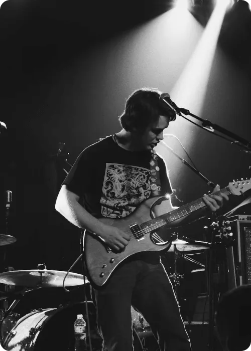 man plays guitar