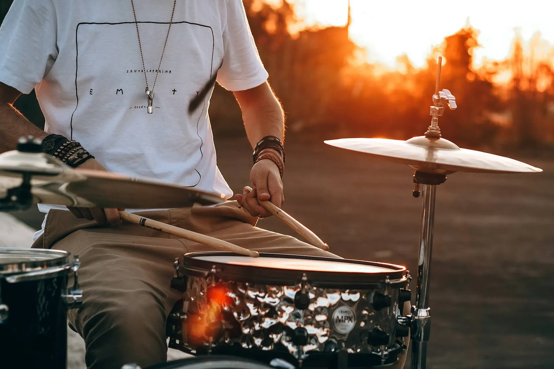 man plays drums